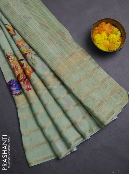 Semi georgette saree pastel green with allover floral prints and long zari woven border