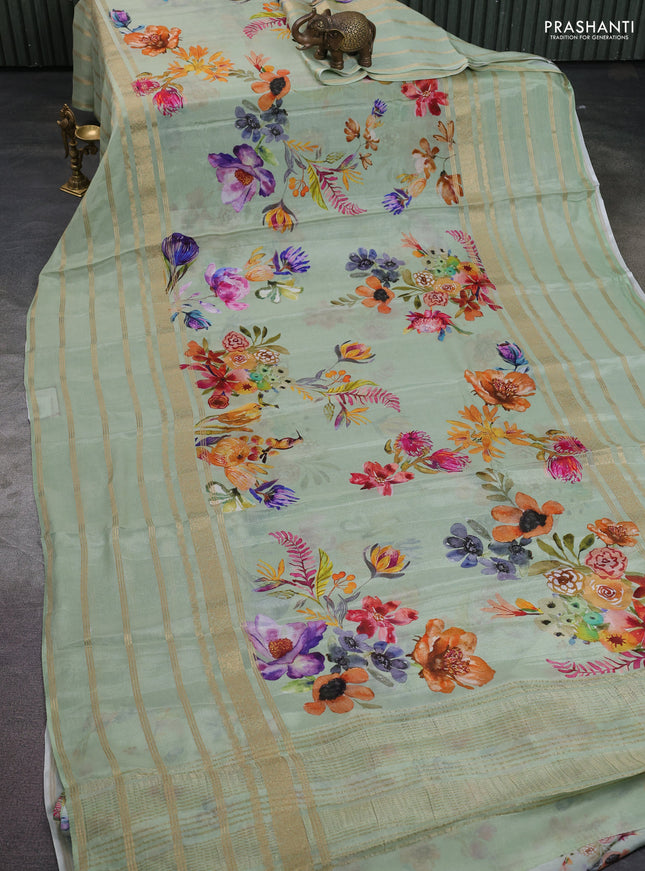 Semi georgette saree pastel green with allover floral prints and long zari woven border
