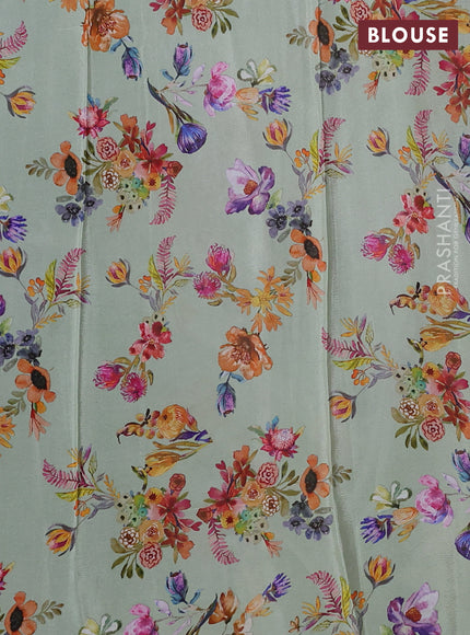 Semi georgette saree pastel green with allover floral prints and long zari woven border
