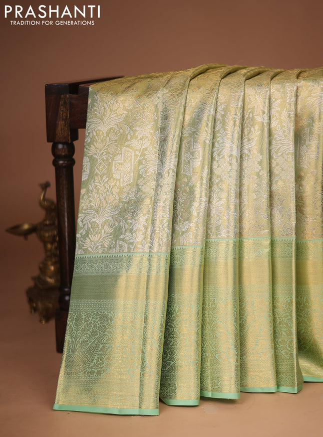 Pure kanchipuram tissue silk saree pista green with allover zari woven brocade weaves and zari woven border