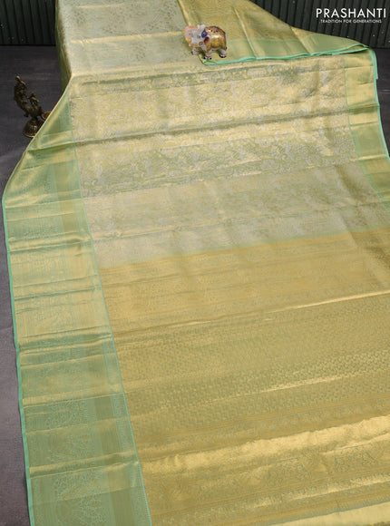 Pure kanchipuram tissue silk saree pista green with allover zari woven brocade weaves and zari woven border