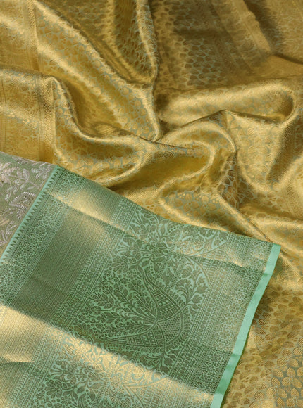 Pure kanchipuram tissue silk saree pista green with allover zari woven brocade weaves and zari woven border