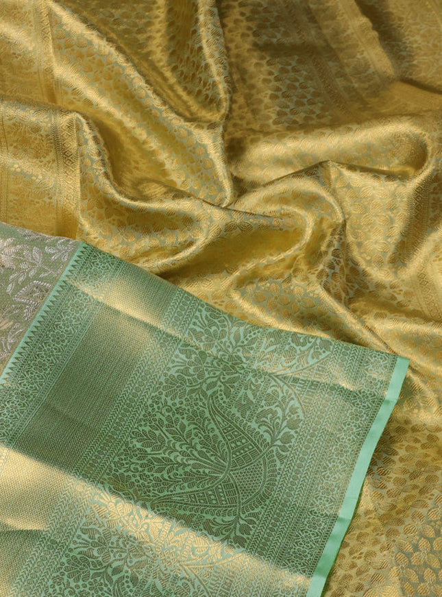Pure kanchipuram tissue silk saree pista green with allover zari woven brocade weaves and zari woven border