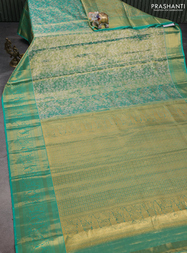 Pure kanchipuram tissue silk saree teal green with allover silver zari woven brocade weaves and zari woven border