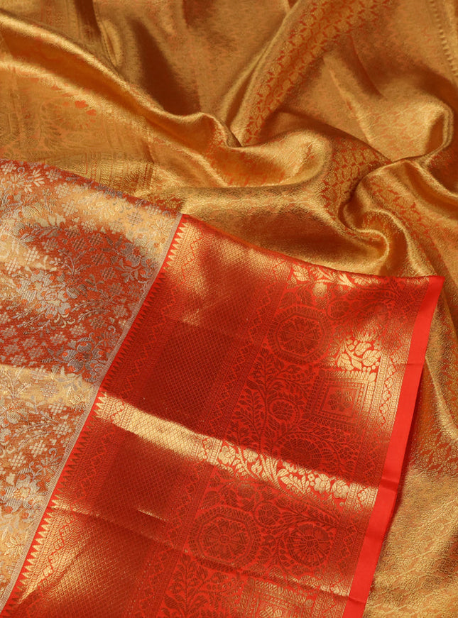 Pure kanchipuram tissue silk saree orange with allover zari woven brocade weaves and zari woven border
