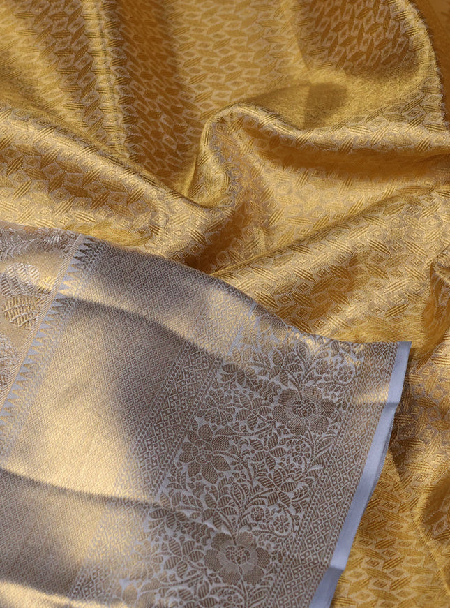 Pure kanchipuram tissue silk saree grey with allover zari woven brocade weaves and zari woven border