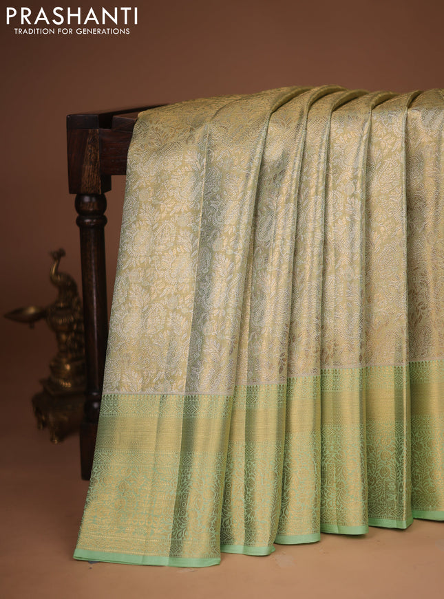 Pure kanchipuram tissue silk saree pista green with allover zari woven brocade weaves and zari woven border