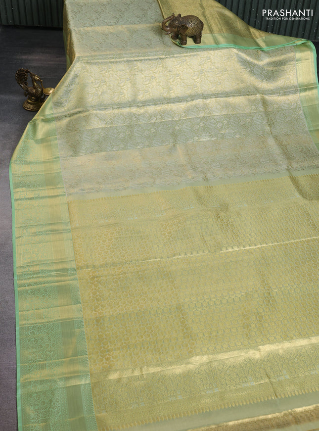 Pure kanchipuram tissue silk saree pista green with allover zari woven brocade weaves and zari woven border