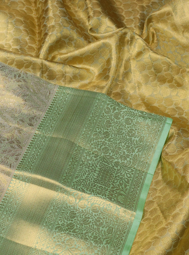 Pure kanchipuram tissue silk saree pista green with allover zari woven brocade weaves and zari woven border