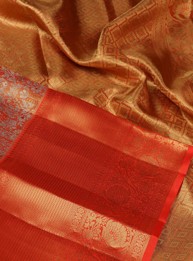Pure kanchipuram tissue silk saree orange with allover silver zari woven brocade weaves and zari woven border