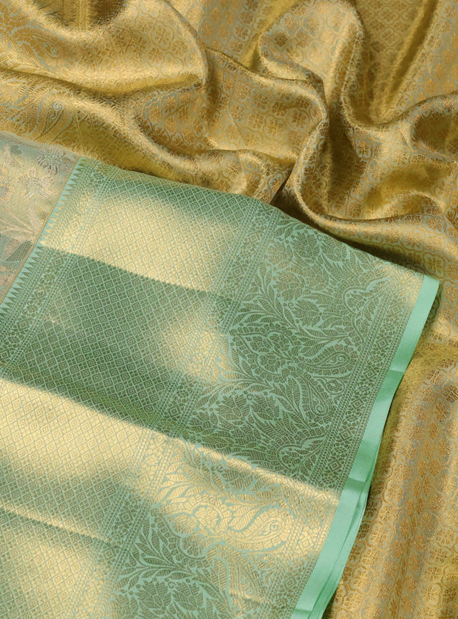 Pure kanchipuram tissue silk saree pista green with allover zari woven brocade weaves and zari woven border