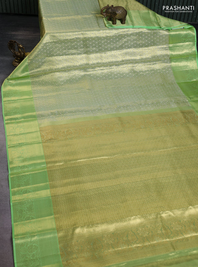Pure kanchipuram tissue silk saree pista green with allover zari woven brocade weaves and zari woven border