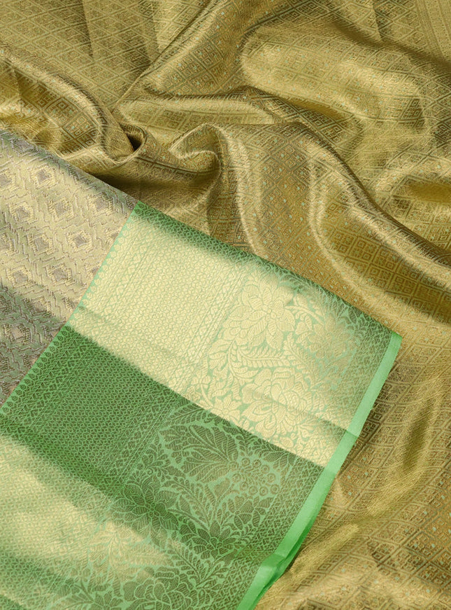 Pure kanchipuram tissue silk saree pista green with allover zari woven brocade weaves and zari woven border