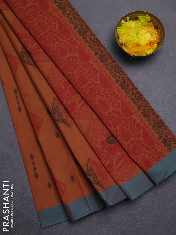Nithyam cotton saree rust shade and teal green with thread woven geometric buttas and simple border