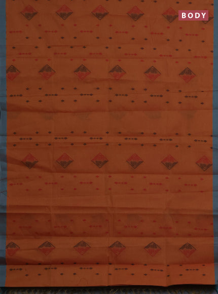Nithyam cotton saree rust shade and teal green with thread woven geometric buttas and simple border