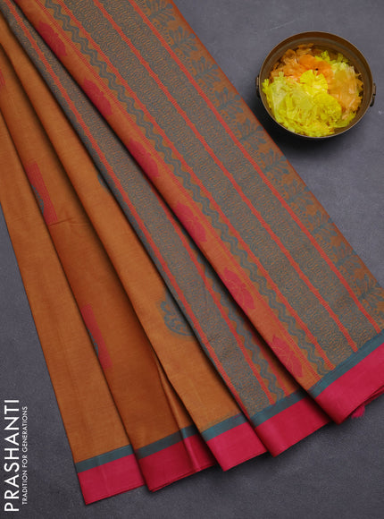 Nithyam cotton saree dark mustard and pink with thread woven buttas and simple border