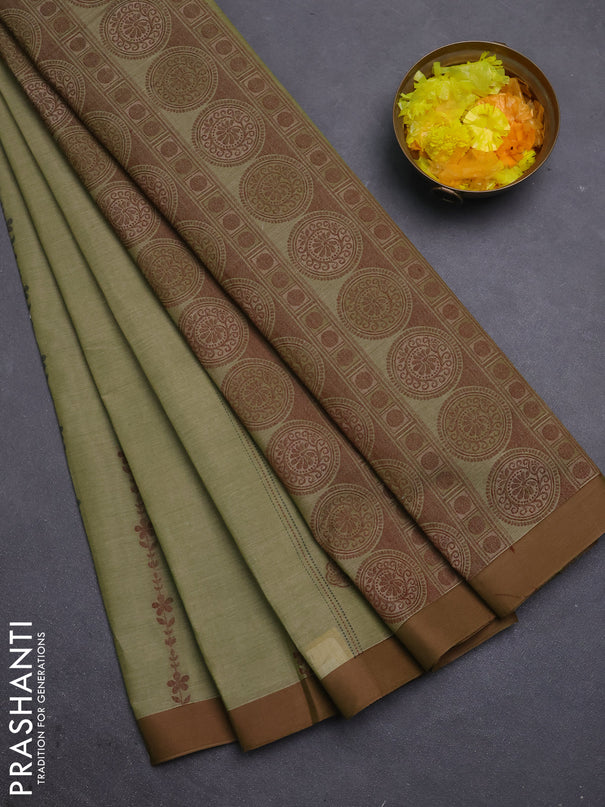 Nithyam cotton saree pastel green and brown with allover thread weaves & buttas and simple border