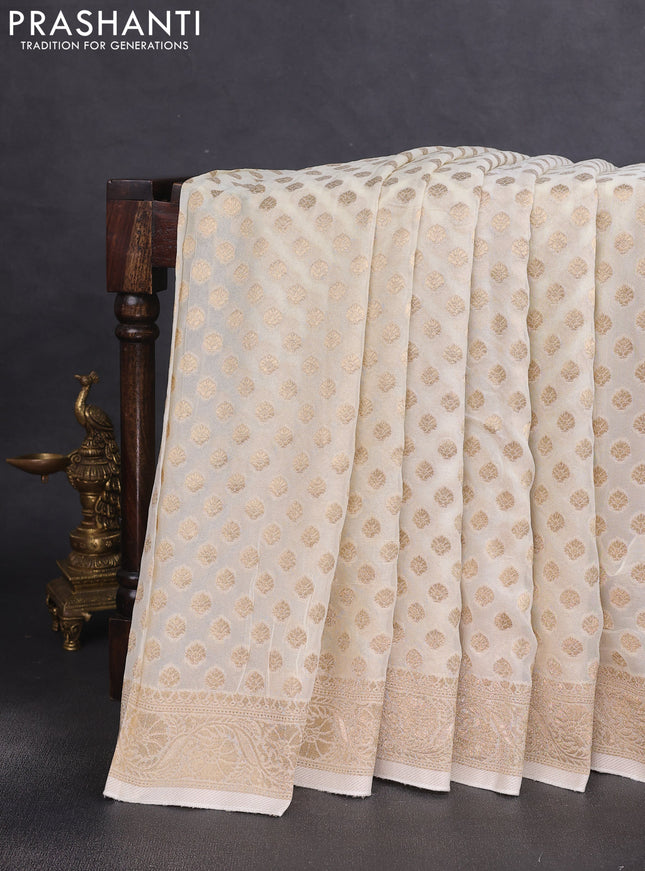 Banarasi semi georgette saree off white with allover zari woven buttas and zari woven border