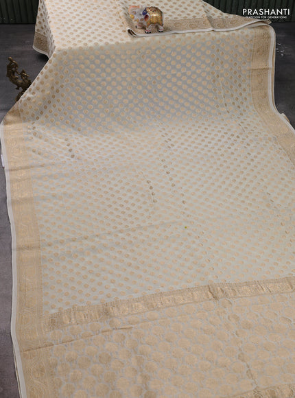 Banarasi semi georgette saree off white with allover zari woven buttas and zari woven border