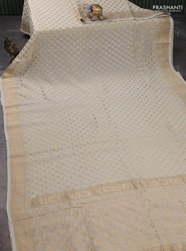 Banarasi semi georgette saree off white with allover zari woven buttas and zari woven border