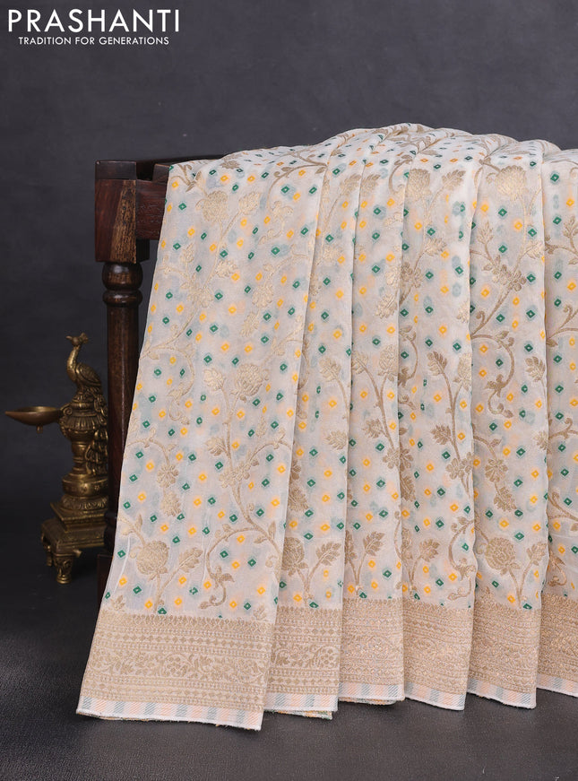 Banarasi semi georgette saree cream with allover zari weaves & bandhani thread buttas and zari woven border