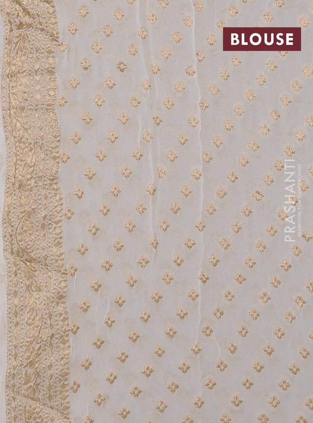 Banarasi semi georgette saree cream with allover zari weaves & bandhani thread buttas and zari woven border
