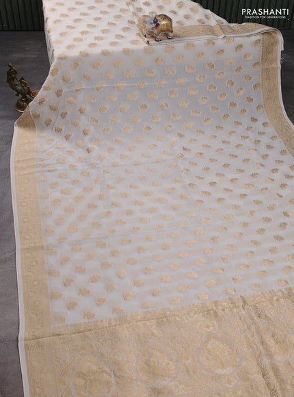 Banarasi semi georgette saree off white with allover floral zari buttas and zari woven border