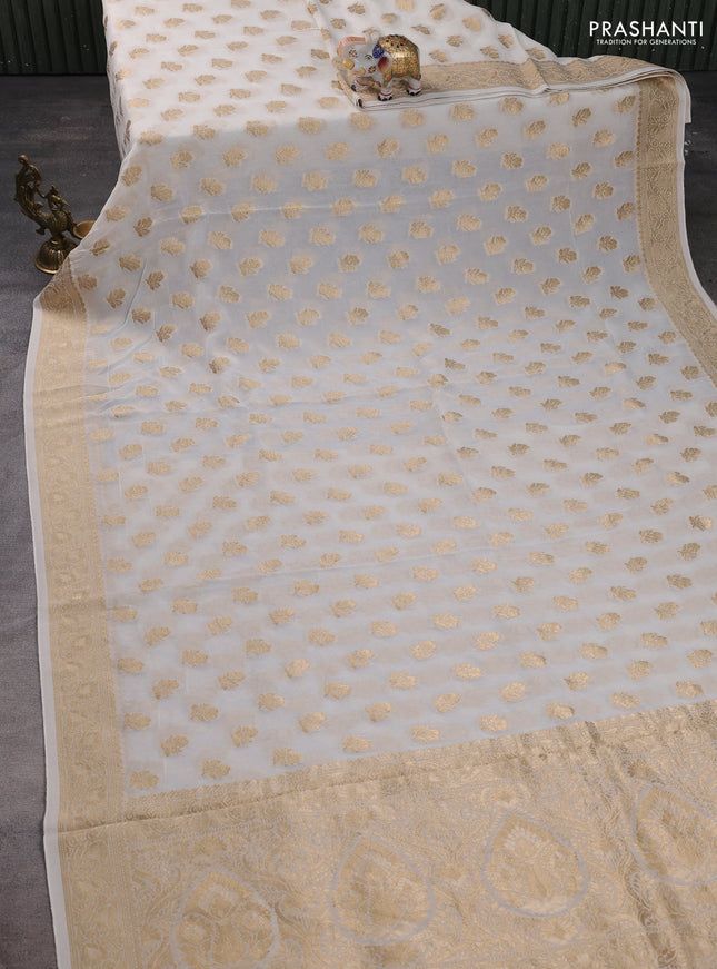 Banarasi semi georgette saree off white with allover floral zari buttas and zari woven border
