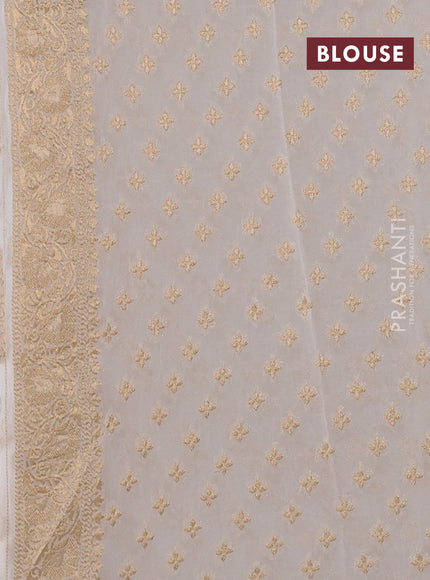 Banarasi semi georgette saree off white with allover floral zari buttas and zari woven border