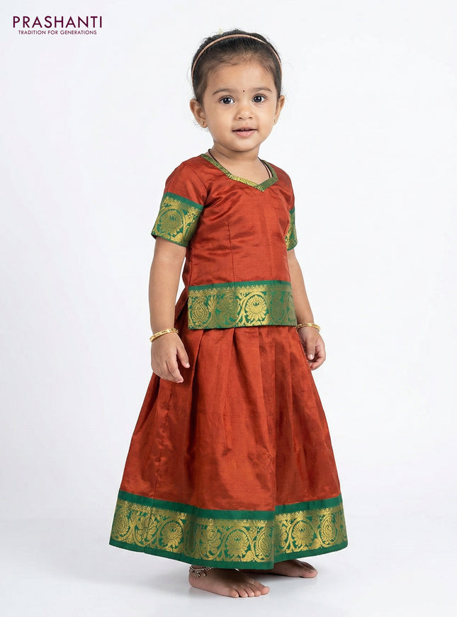 Pure silk unstitched kids lehenga rustic orange and green with plain body and zari woven border