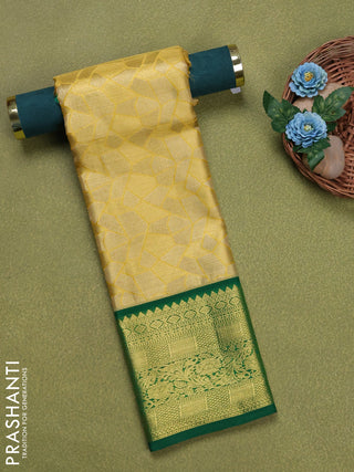 Pure silk tissue unstitched kids lehenga gold and green with allover zari woven brocade weaves and rich zari woven border