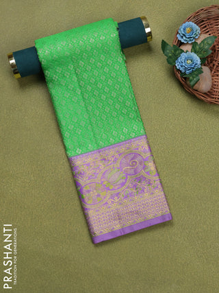 Pure silk unstitched kids lehenga green and lavender with allover silver zari woven brocade weaves and rich zari woven border