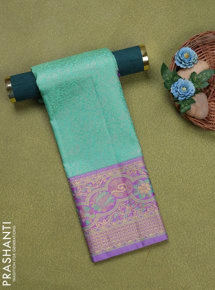 Pure silk unstitched kids lehenga teal green shade and lavender with allover silver zari woven brocade weaves and rich zari woven border