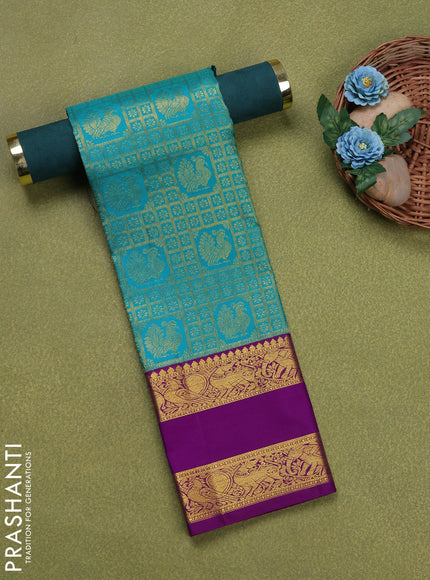 Pure silk unstitched kids lehenga teal green and purple with allover zari woven brocade weaves and rettapet zari woven border