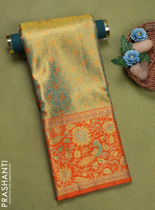 Pure silk tissue unstitched kids lehenga dual shade of green and orange with allover zari woven brocade weaves and rich zari woven border