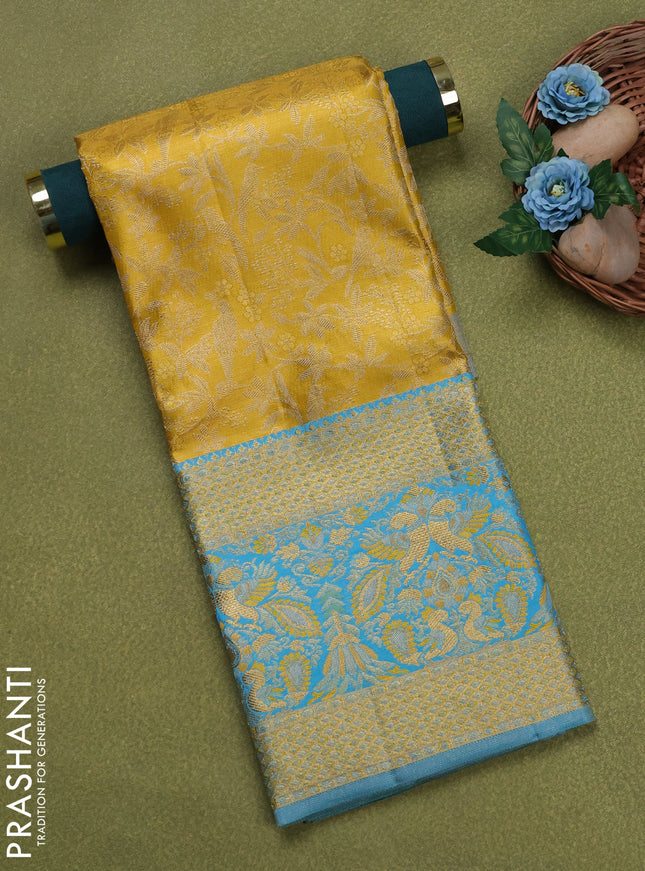 Pure silk tissue unstitched kids lehenga yellow and light blue with allover zari woven brocade weaves and rich zari woven border