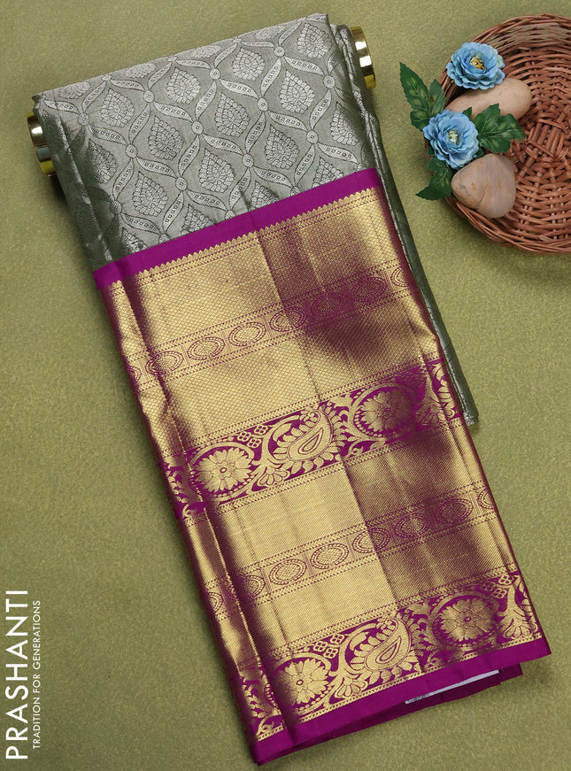 Pure silk tissue unstitched kids lehenga sap green and purple with allover silver zari woven brocade weaves and long zari woven border