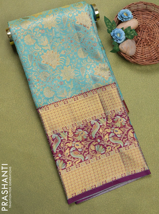 Pure silk tissue unstitched kids lehenga teal blue and purple with allover zari woven brocade weaves and long zari woven border