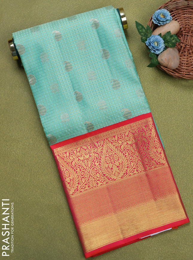 Pure silk unstitched kids lehenga teal green shade and dual shade of pinkish orange with allover zari woven brocade weaves and long zari woven border