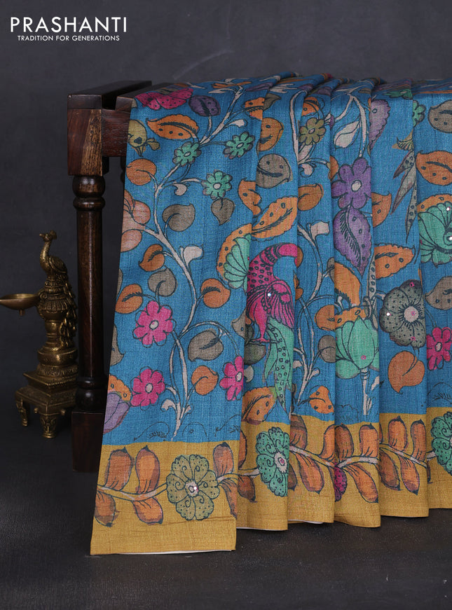 Semi tussar saree cs blue and green with allover kalamkari prints and mirror work
