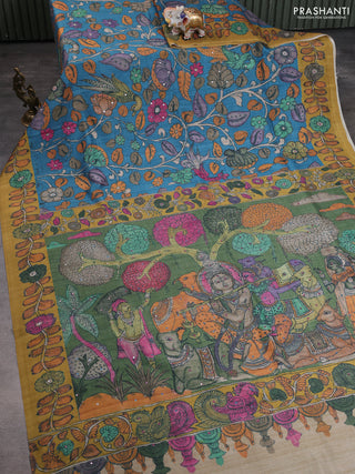 Semi tussar saree cs blue and green with allover kalamkari prints and mirror work