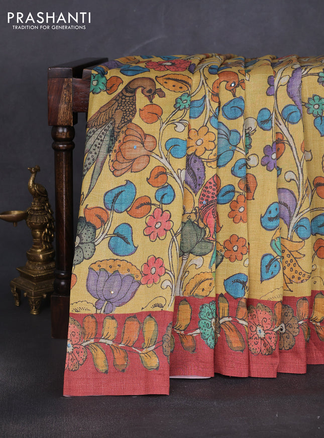 Semi tussar saree yellow and rustic orange with allover kalamkari prints and mirror work