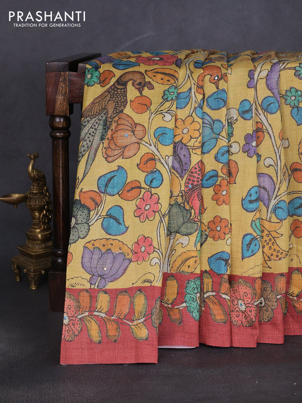 Semi tussar saree yellow and rustic orange with allover kalamkari prints and mirror work