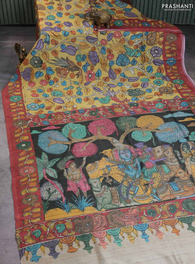 Semi tussar saree yellow and rustic orange with allover kalamkari prints and mirror work