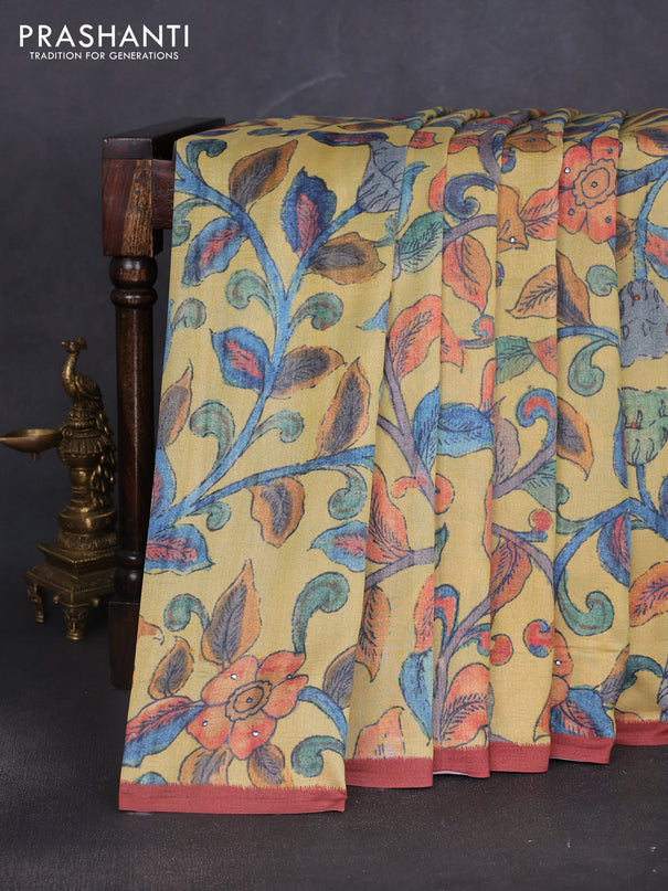 Semi tussar saree yellow and rust shade with allover kalamkari prints and mirror work