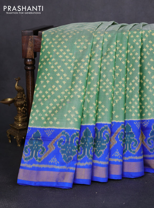 Rajkot patola silk saree green and royal blue with allover ikat weaves and ikat woven zari border