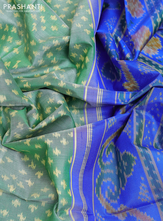 Rajkot patola silk saree green and royal blue with allover ikat weaves and ikat woven zari border