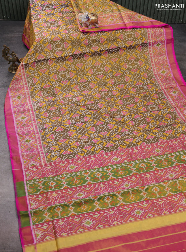 Rajkot patola tissue silk saree mehendi green and pink with allover ikat weaves and ikat woven zari border