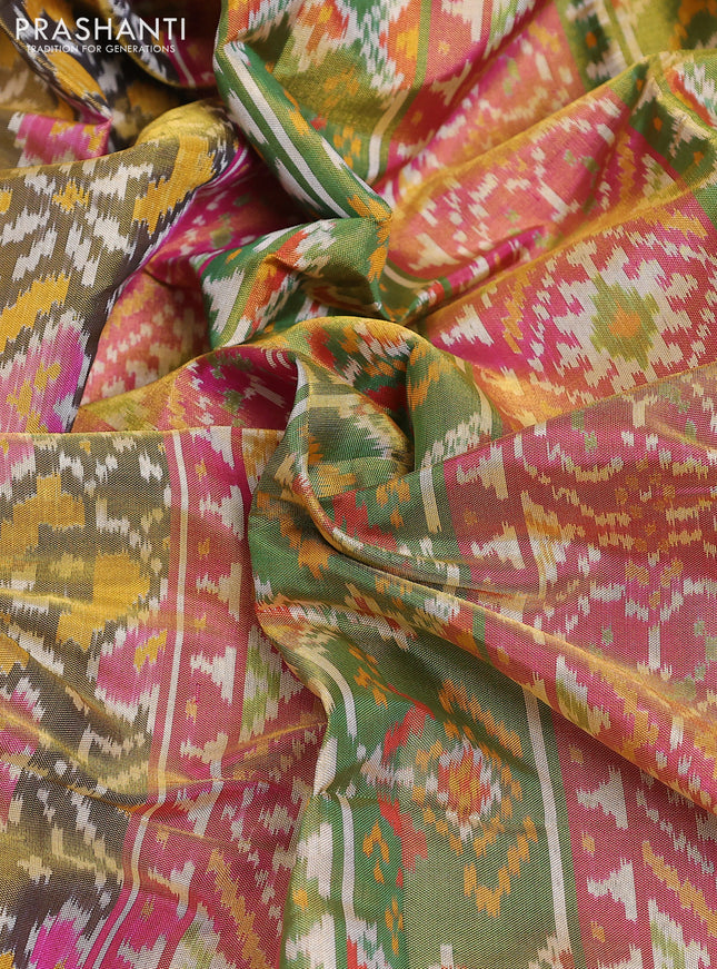 Rajkot patola tissue silk saree mehendi green and pink with allover ikat weaves and ikat woven zari border