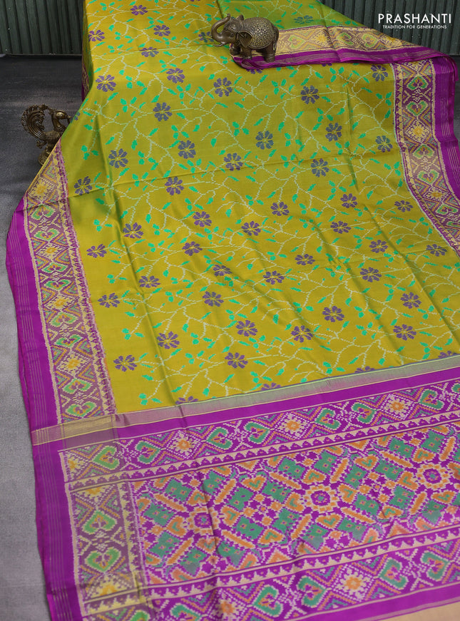 Rajkot patola silk saree light green and magenta pink with allover ikat weaves and ikat woven border